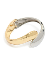 Showcasing a waterproof mixed plated stainless steel round twisted cuff bangle in silver and gold with chunky styling front view - link has visual effect only