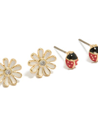 Crafted from enamel, crystal, and cubic zirconia, this stud style 2-pack showcases animal ladybug and floral in gold plated finish close up view - link has visual effect only