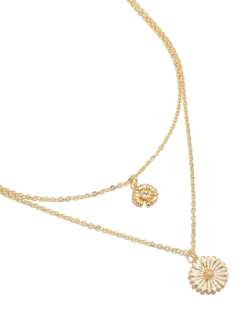 Discover this gold plated cubic zirconia daisy floral layered necklace with white enamel in a dainty style close up view