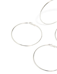 Featuring silver large hoop earrings in a 2-pack and classic closure close up view - link has visual effect only