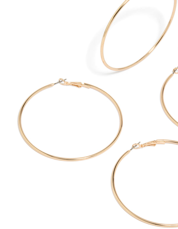 Crafted from gold large hoop earrings 2-pack featuring statement design close up view