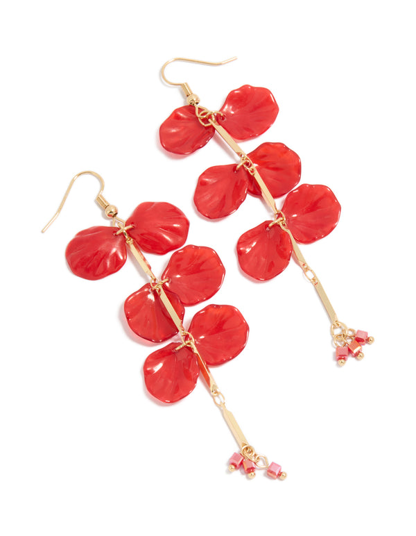 Showcasing red beaded petal drop earrings in gold and coral tones front view