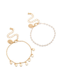 Showcasing gold discs and pearl 2-pack bracelets front view - link has visual effect only