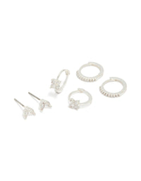 Showcasing silver plated flower huggie and leaf stud earrings in a 3-pack front view - link has visual effect only