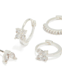 Featuring silver plated flower huggie and leaf stud earrings in a 3-pack close up view - link has visual effect only