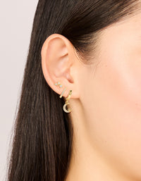Featuring celestial charm gold plated cubic zirconia and crescent moon hoop earrings 3-pack with crystal huggie closure in clear stone on ear view - link has visual effect only