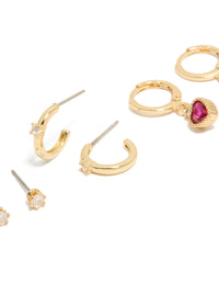 Explore gold plated cubic zirconia studs and heart huggie earrings with charm featuring crystal closure hoop in a 3-pack set close up view - link has visual effect only