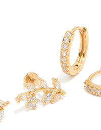 Featuring gold plated brass vine flat back studs and huggie earrings pack with leaf design and cubic zirconia in a close up view - link has visual effect only