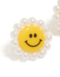 Designed with acrylic flower smiley face stud earrings featuring pearl border in yellow and white close up view - link has visual effect only