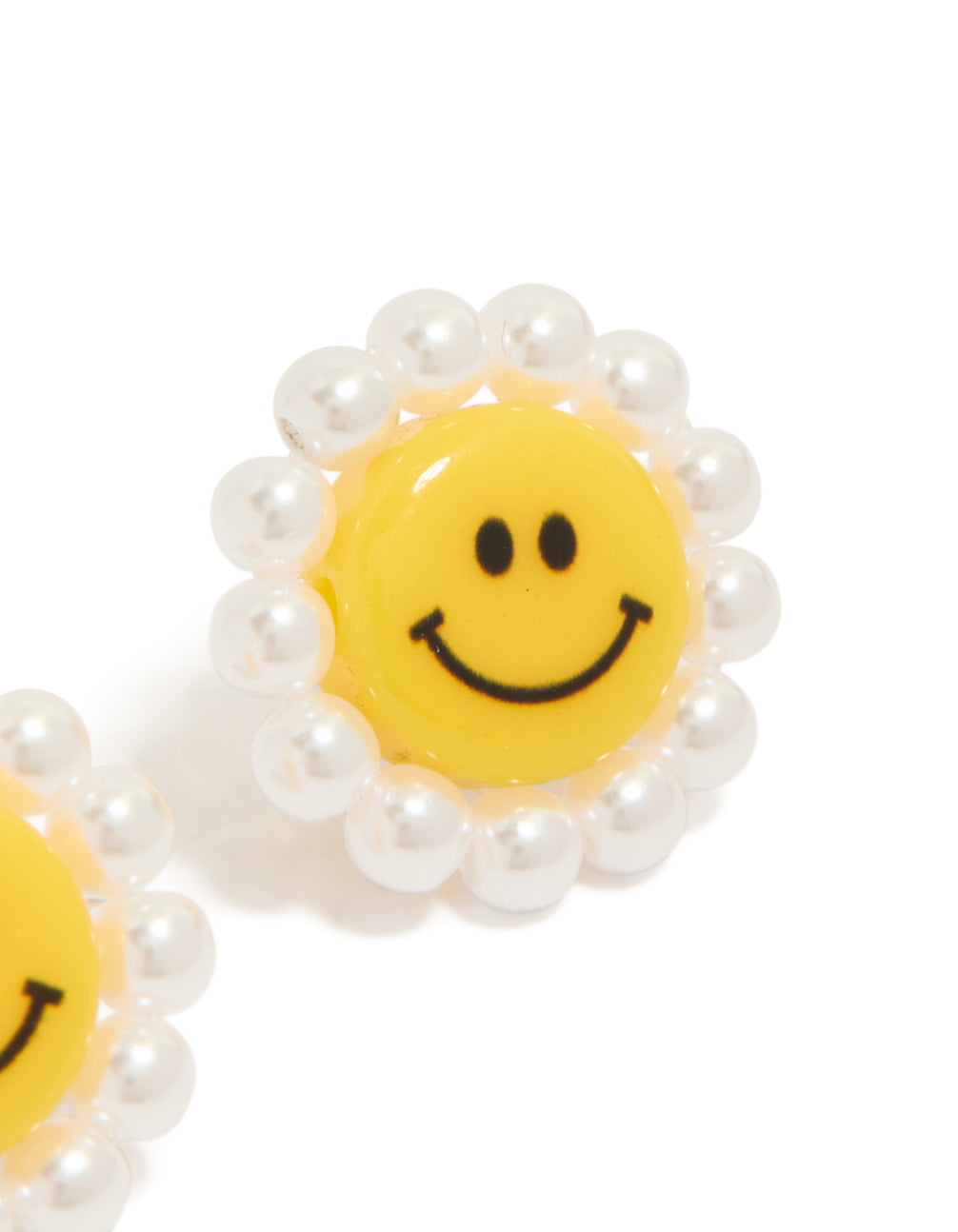 These floral stud earrings with pearl accents in yellow and white acrylic post detail view