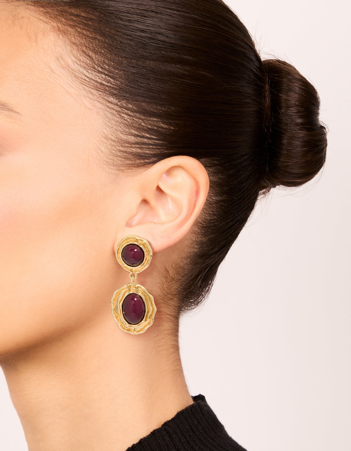 Showcasing gold double burgundy resin drop earrings crafted from statement materials in maroon on ear view