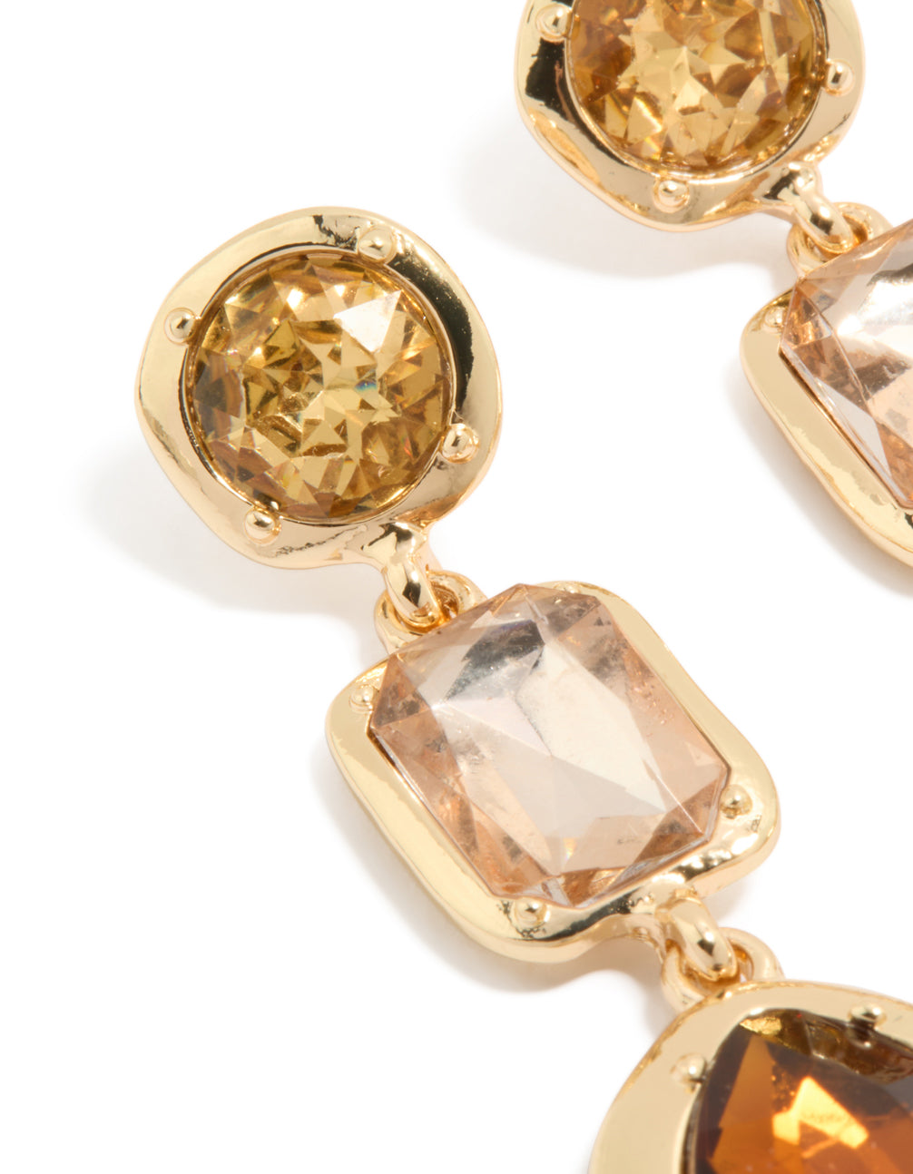 Showcasing statement gold brown diamantes drop earrings close up view
