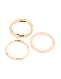 Discover chunky gold textured and resin bangles in a 3-pack with peachpuff accents front view - link has visual effect only