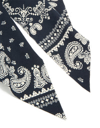 Showcasing paisley printed scarf scrunchie in black and ivory with statement detailing detail view - link has visual effect only
