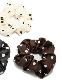 Crafted with polka dot pattern in a 3-pack featuring black, ivory, saddle brown, and white scrunchies side view - link has visual effect only