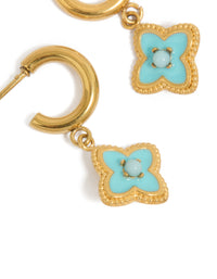 Featuring gold plated stainless steel blue enamel flower hoop earrings close up view - link has visual effect only