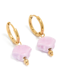These gold plated stainless steel huggie earrings feature pink shell in an ocean-inspired design front view - link has visual effect only