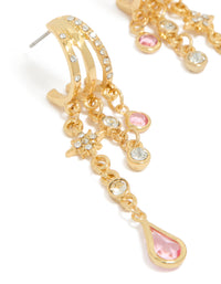 Highlighting chain drop earrings featuring star celestial charm details with gold plated cubic zirconia stones in pink and clear close up view - link has visual effect only