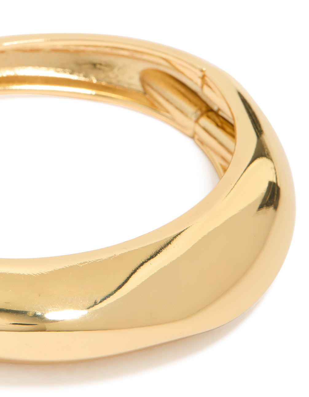 Designed with gold plated material, this thick organic chunky bangle in statement style close up view