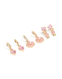 Featuring gold pink diamante flower and heart huggie earrings in a 3-pack with oval stone cut front view - link has visual effect only