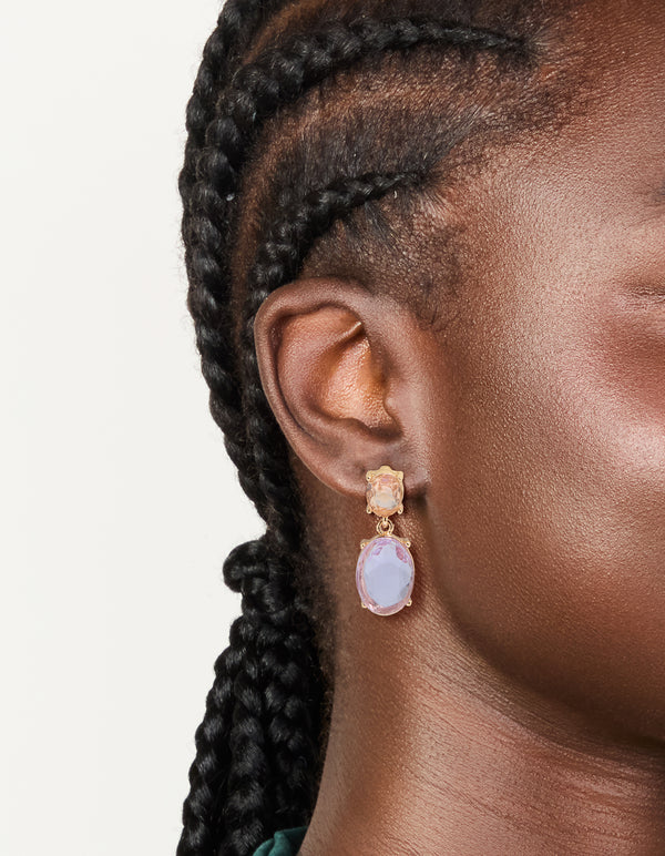 Featuring statement gold purple and orange diamantes double drop earrings on ear view