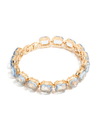Showcasing a gold large light blue diamantes bracelet front view - link has visual effect only