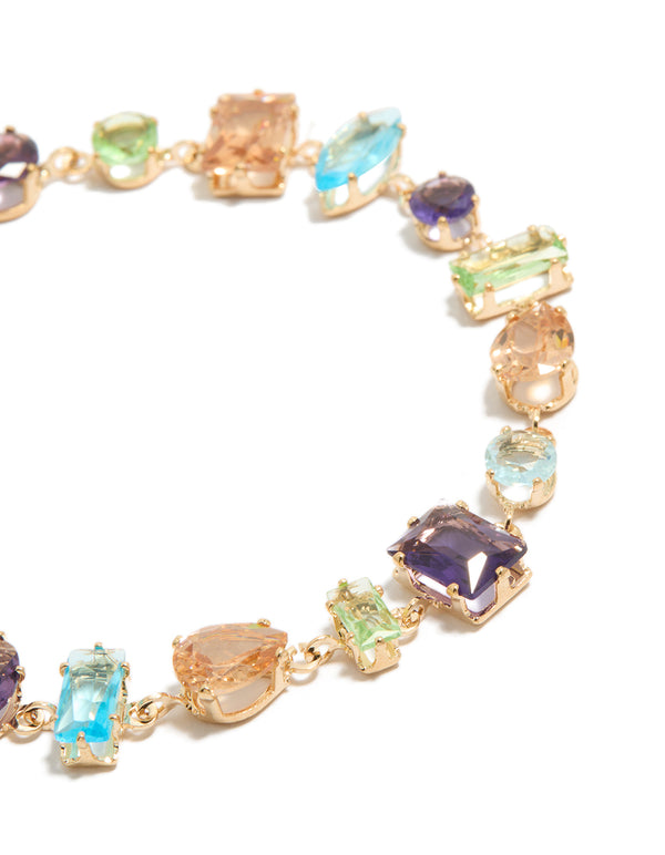 Crafted with design featuring irregular shaped multicoloured diamantes in stackable gold close up view