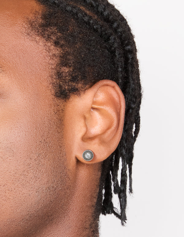 Shop waterproof stainless steel round cubic zirconia flat back studs shown in an on ear view