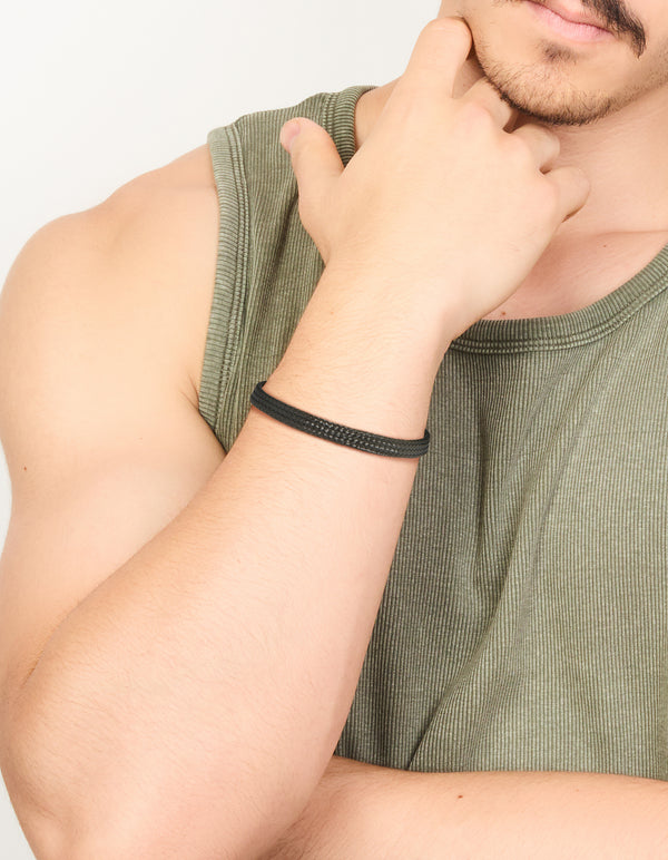 Crafted from waterproof black coated stainless steel, this mens woven wrist cuff bracelet is shown on wrist view