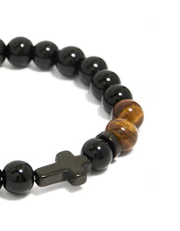 Crafted from waterproof black coated stainless steel with beaded design, tigers eye accents, and cross close up view - link has visual effect only