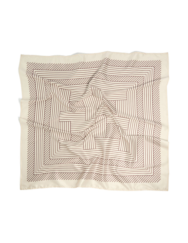 Elegant scarf featuring geometric wavy lines with cornsilk and brown tones detail view