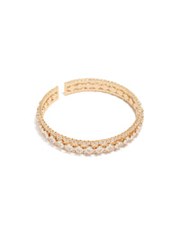 Showcasing a gold cubic zirconia circle statement cuff bangle front view - link has visual effect only