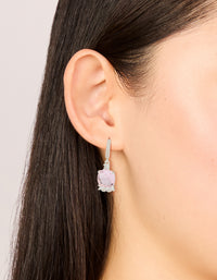 Showcasing silver plated cubic zirconia pink square drop huggie earrings with crystal detailing on ear view - link has visual effect only