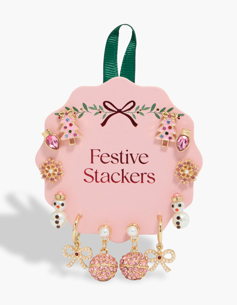Showcasing a festive 6-pack of gold stud earrings featuring snowman, bauble balls, snowflake, bow, tree, and pearl accents in pink, white, and green front view