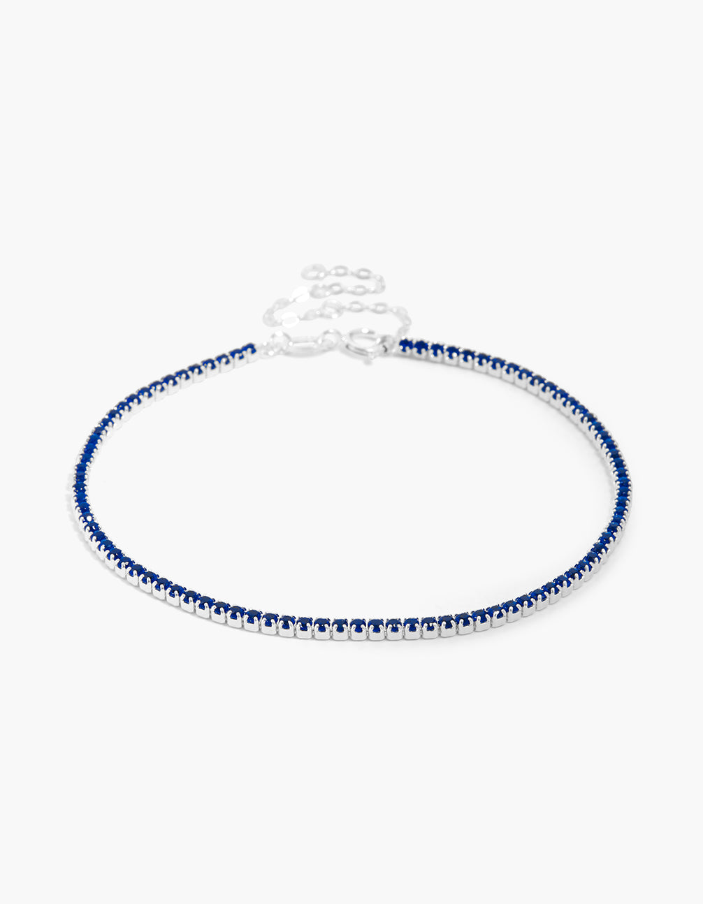 Showcasing a sterling silver dark blue cubic zirconia tennis bracelet front view