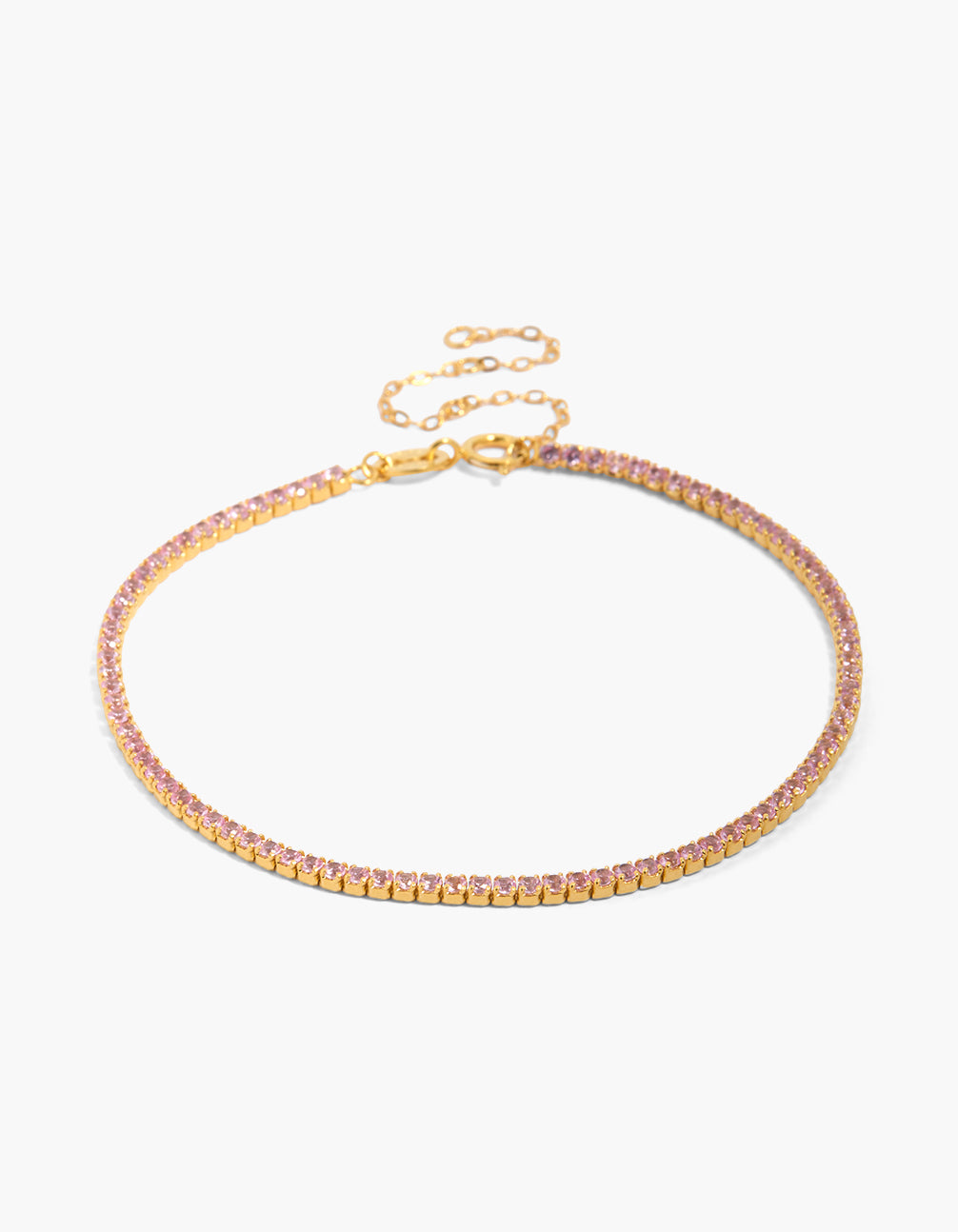 Showcasing a dainty gold plated sterling silver tennis bracelet with pink cubic zirconia front view