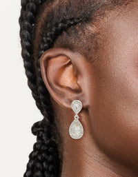 Featuring silver double oval diamante drop earrings with pear cut stones on ear view - link has visual effect only