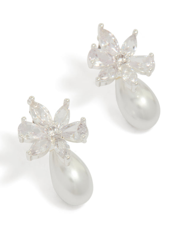 Beautifully crafted floral stud earrings featuring pearl drops and cubic zirconia detailing in a silver plated finish front view