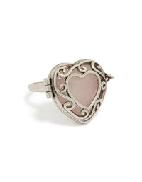 Showcasing an antique silver heart stone locket ring in rosy brown front view - link has visual effect only
