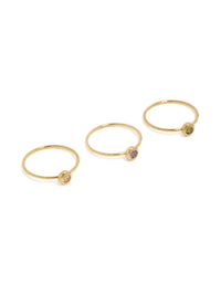 Showcasing gold plated stainless steel dainty cubic zirconia circle rings in a 3-pack featuring pink, lavender, and olive stones front view - link has visual effect only
