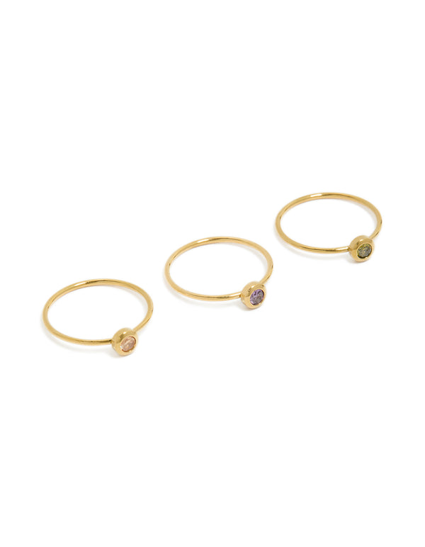 Showcasing gold plated stainless steel dainty cubic zirconia circle rings in a 3-pack featuring pink, lavender, and olive stones front view