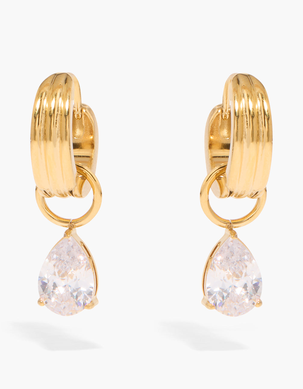 Showcasing waterproof gold plated stainless steel ribbed huggie earrings featuring with pear cut cubic zirconia crystal in clear front view