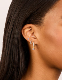 Featuring waterproof gold plated stainless steel pink cubic zirconia mixed earrings in a 3-pack featuring huggie and stud closures on ear view - link has visual effect only