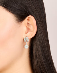 Elegant crystal marquise pearl stud drop earrings featuring white and silver design on ear view - link has visual effect only