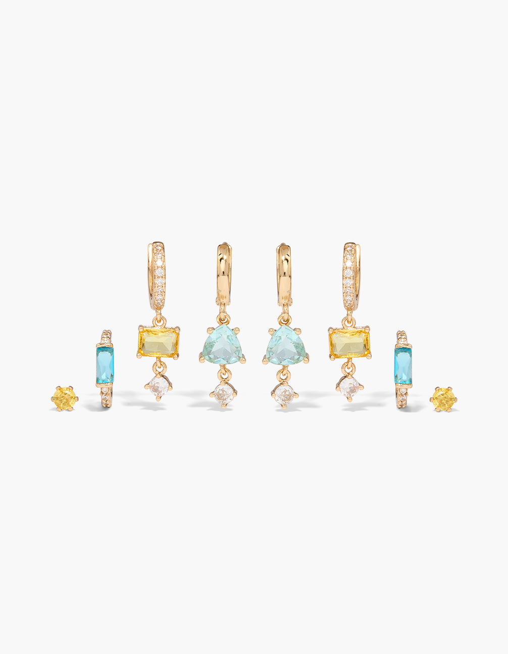 Featuring gold aqua and yellow cubic zirconia earrings in a 4-pack with huggie closure, charm details, and crystal embellishments front view