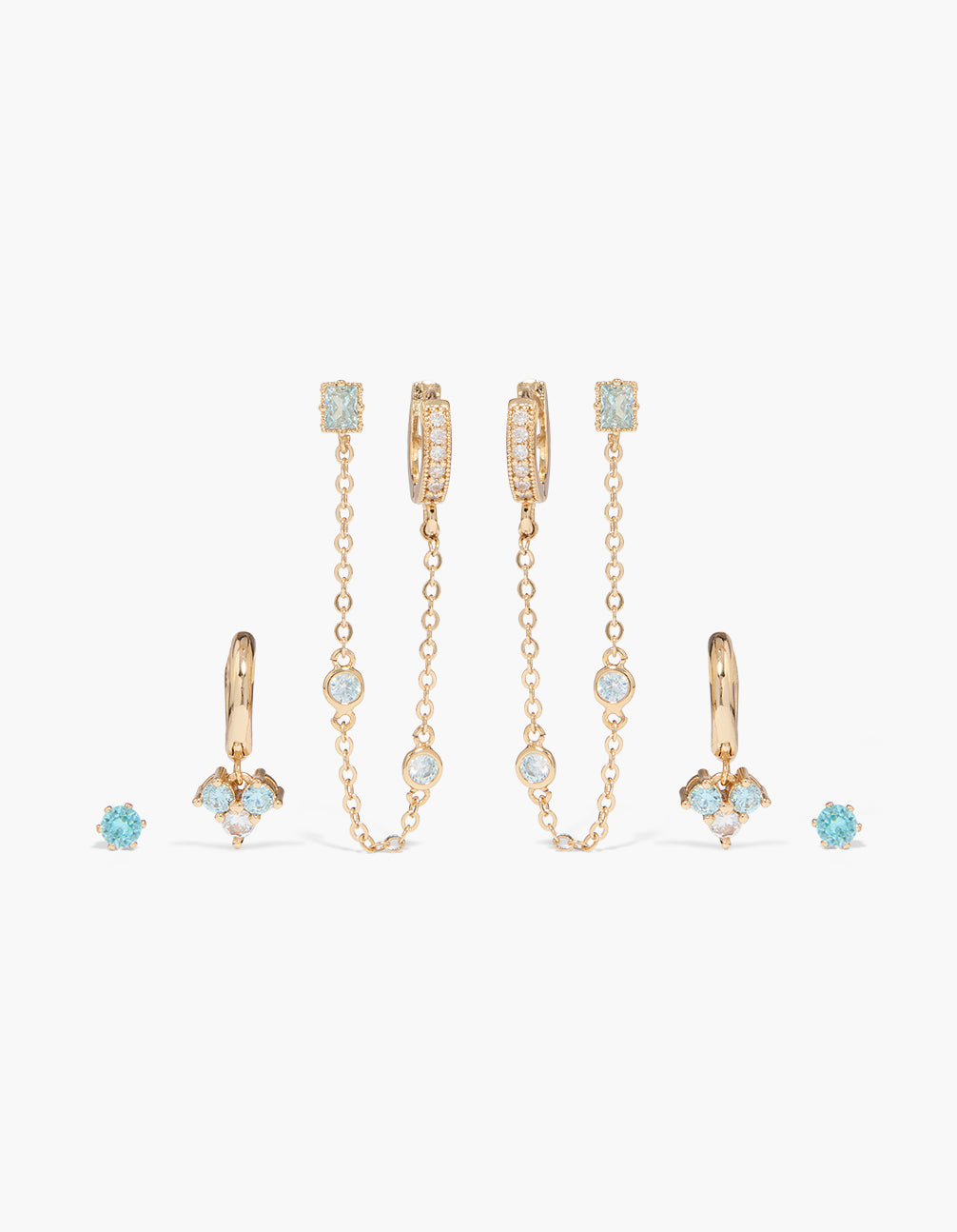 Showcasing charm chain drop and stud earrings 4-pack featuring cubic zirconia crystal with huggie closures in light blue white gold front view