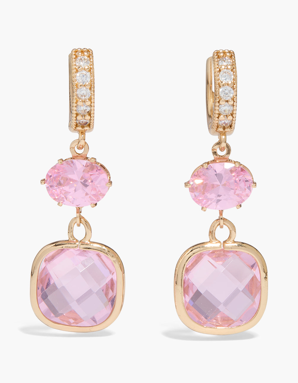 Showcasing dainty huggie earrings in gold featuring double pink oval cut cubic zirconia and crystal hoop closure in statement style front view