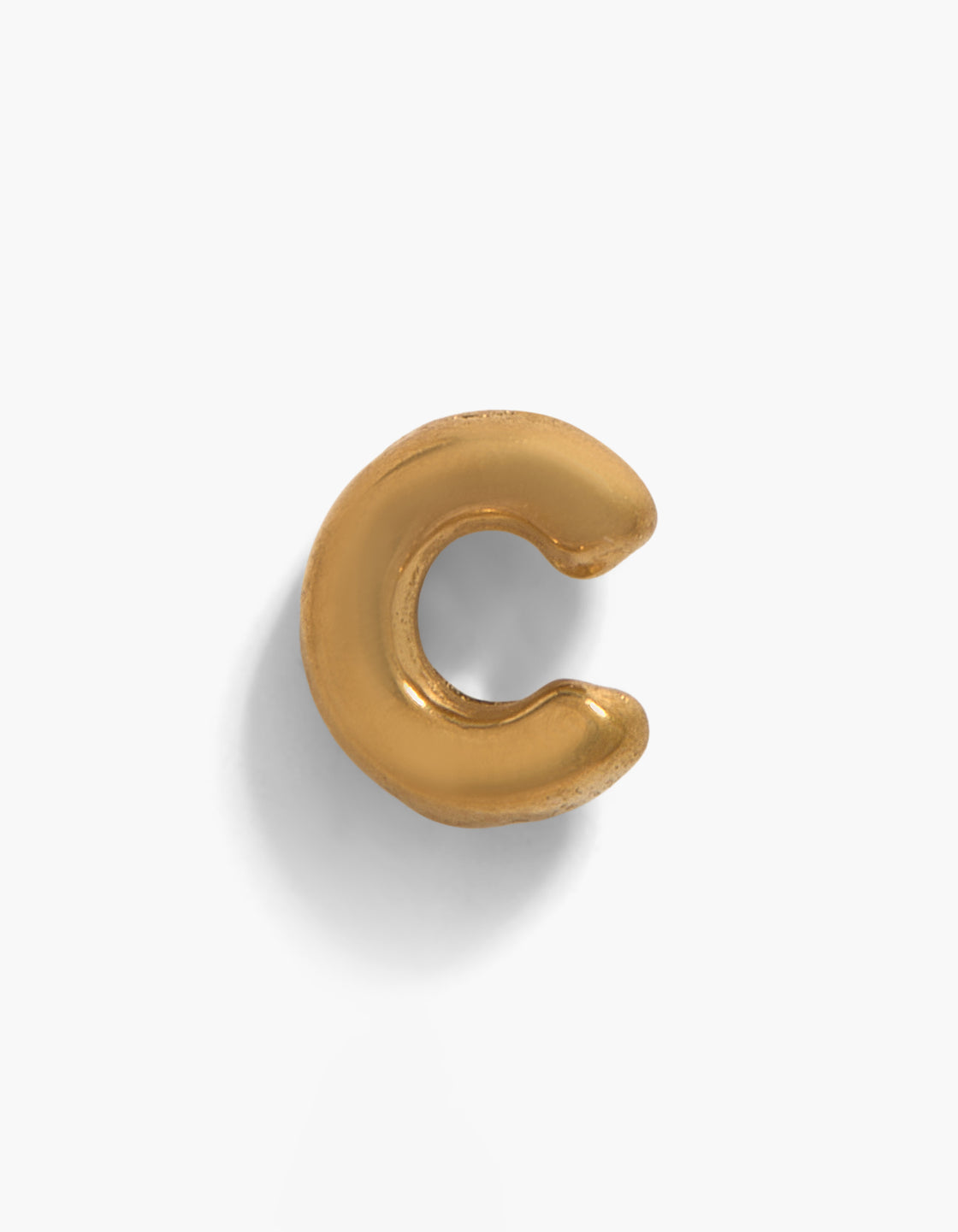 Showcasing a letter C stud featuring initial design in gold plated titanium with threadless flat back closure front view