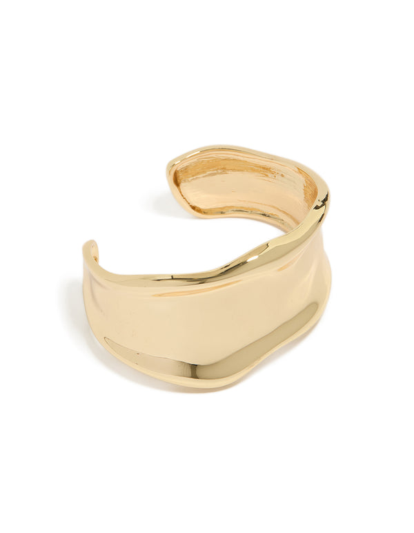 Discover a statement wavy wrist cuff crafted from plated metal in gold bangle front view