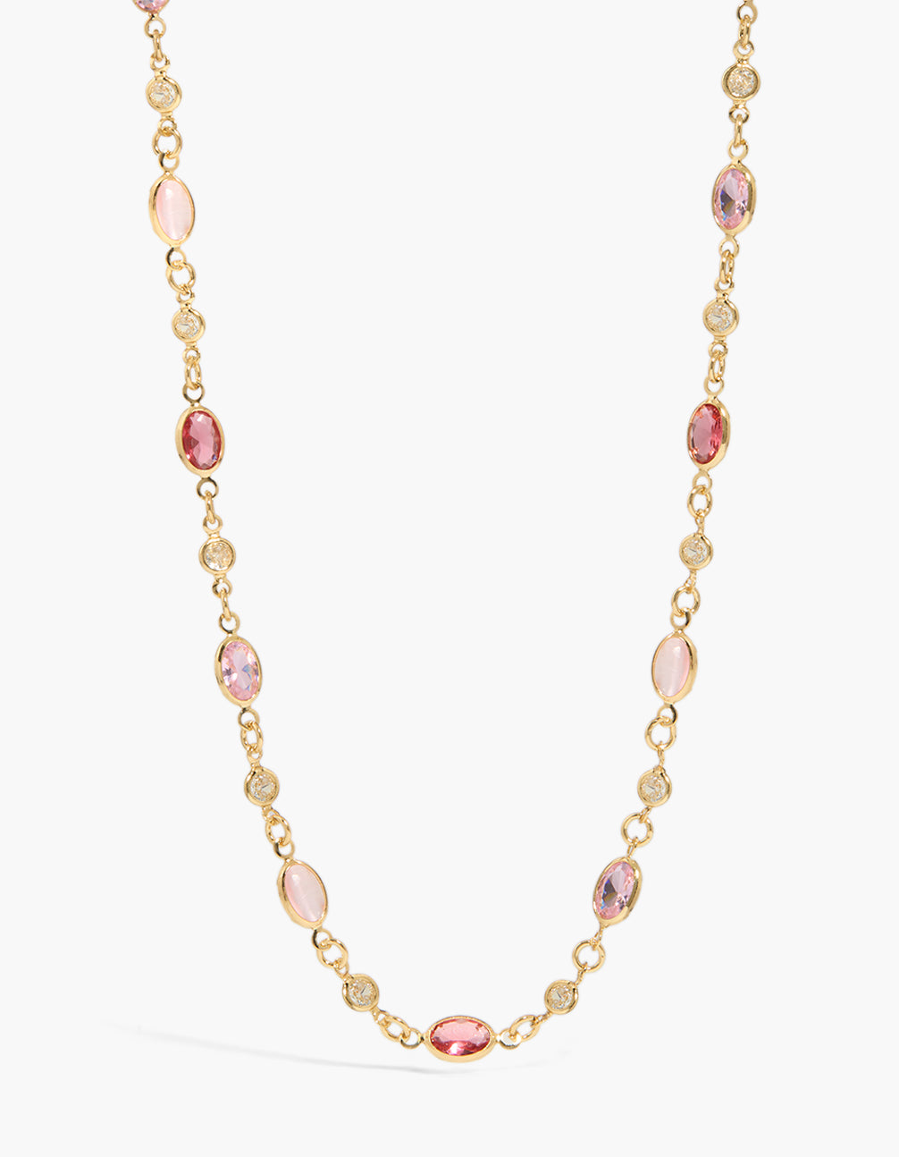 Elegant gold plated necklace featuring pink cubic zirconia oval stones with statement design close up view